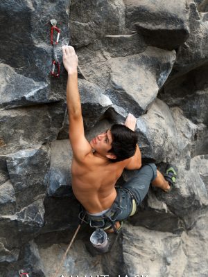 Rock climber searching for a connecting spot